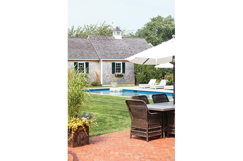 The oversized Edgartown lot features a house, guest house, and pool.