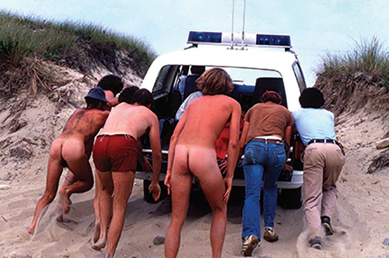 We can be together: When the paddy wagon got stuck in the sand, those arrested for indecent exposure got out and pushed their way to jail.
