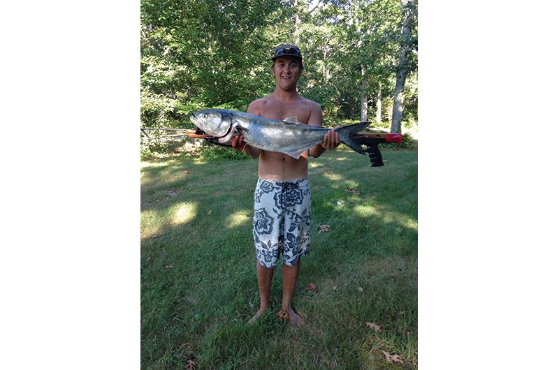 Wyatt Bramhall with a bluefish he speared off of Noman’s Land, south of the Vineyard.