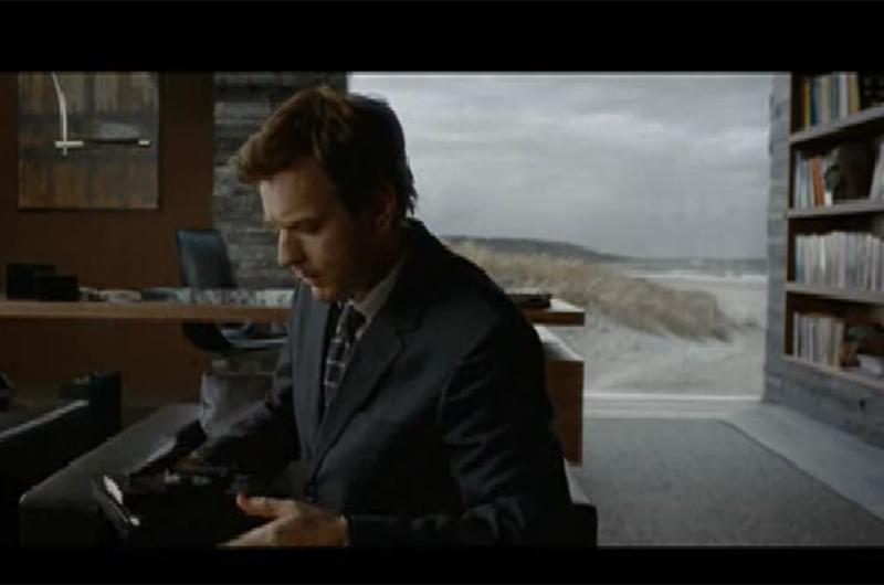 Ewan McGregor in an Island-esque library. 