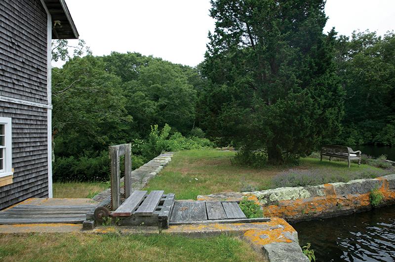 The Fisher Mill, built in 1858 and used to supply grain for Fisher's bakery, still stands on Crocker Pond in West Tisbury.