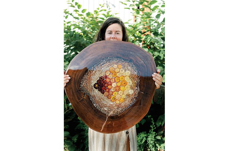 A lazy Susan with various vegetation cast into a hollowed piece of English elm.