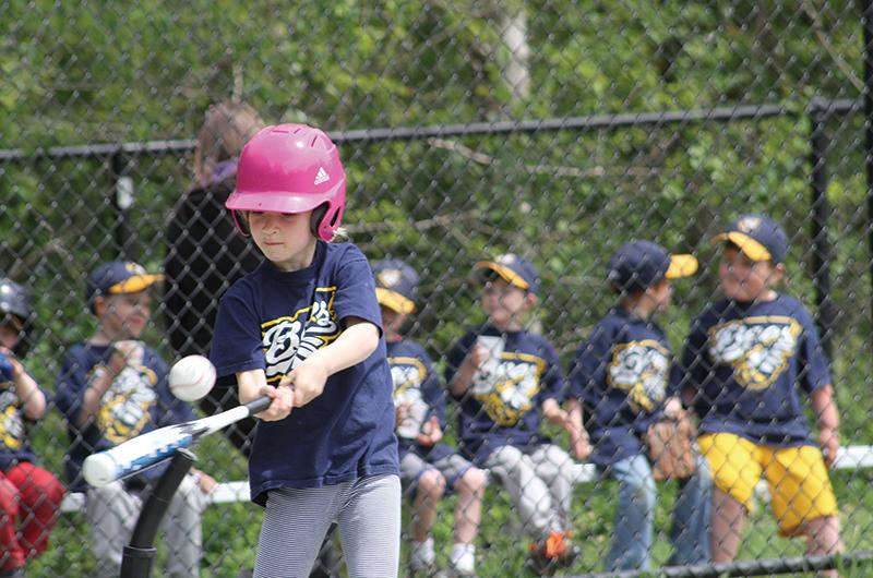 Adelaide deForest swings for the fences at a T-ball match held at the Tisbury School.