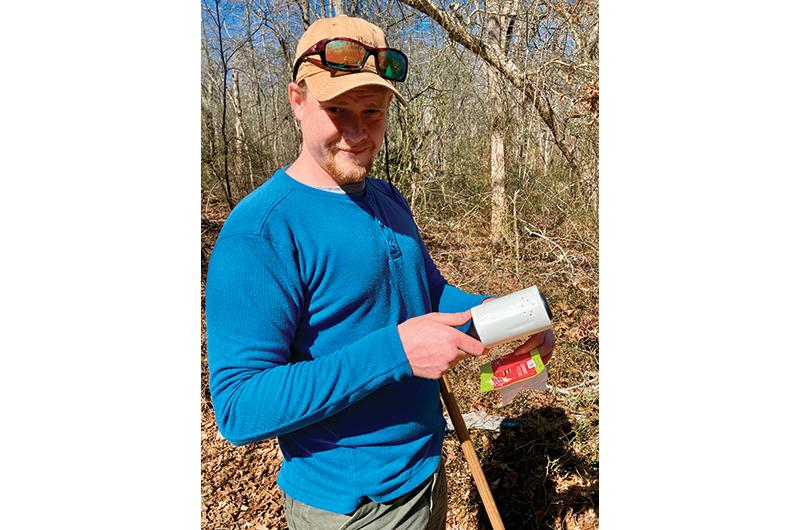 Using lint rollers and white cotton flags, Patrick Roden-Reynolds collect ticks for survey.