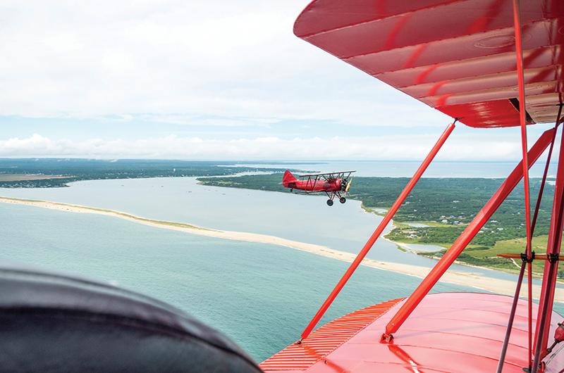 Creato’s fleet, consisting of two scarlet Waco UPF-7s, dates back to the 1940s when they were first used for military flight training. Together, they make more than a thousand flights every summer.