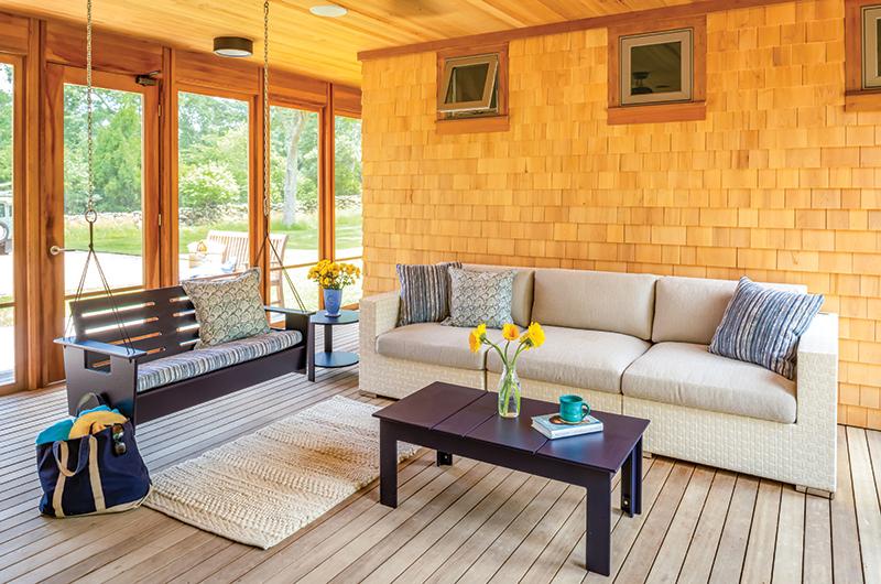Open-air walkways connect the wings of the house and a screened-in porch serves as a place to gather.