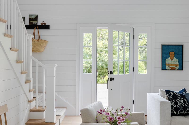 Nickel gap wood paneling gives the living room a casual feel.