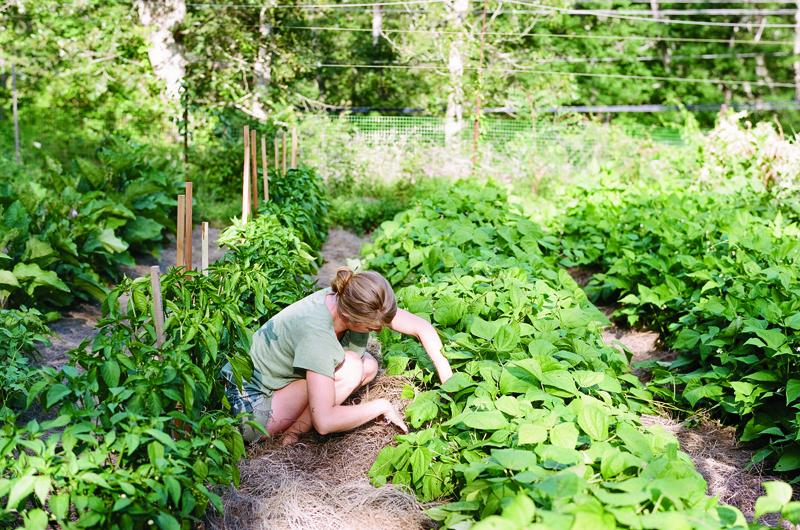 When not in her studio, Young gets her hands dirty helping out with farm chores.